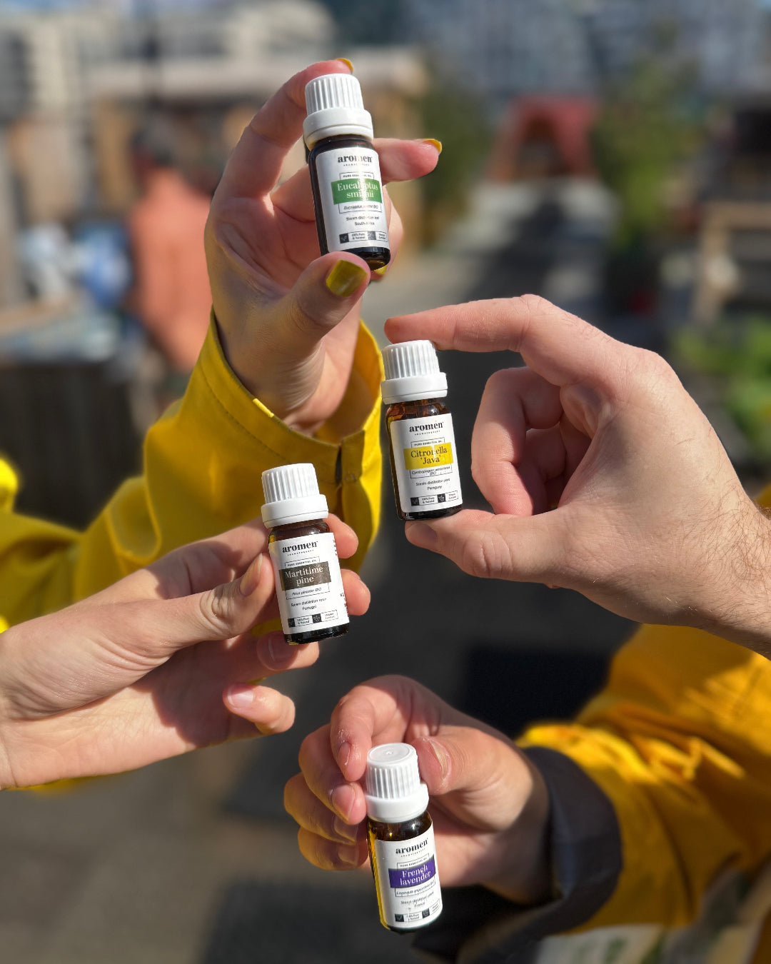 Selection of Aromen essential oils held up for display